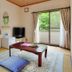 Resort Hotel Chateau Le Fleur in Itō guest room with tatami floor, low table, floor cushions, and balcony view