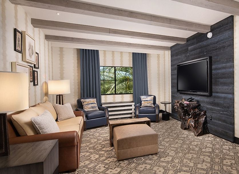 Silverton Casino Lodge, Las Vegas: newly renovated suite with seating area, TV, and bedroom doorway