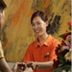 Pod Inn Nanjing Xuanwu Lake Xuanwumen Station staff greets a guest at the front desk in Nanjing