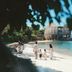 An Lam Retreats Ninh Van Bay in Thon Dam Van, beachfront family scene with kayak and overwater villas
