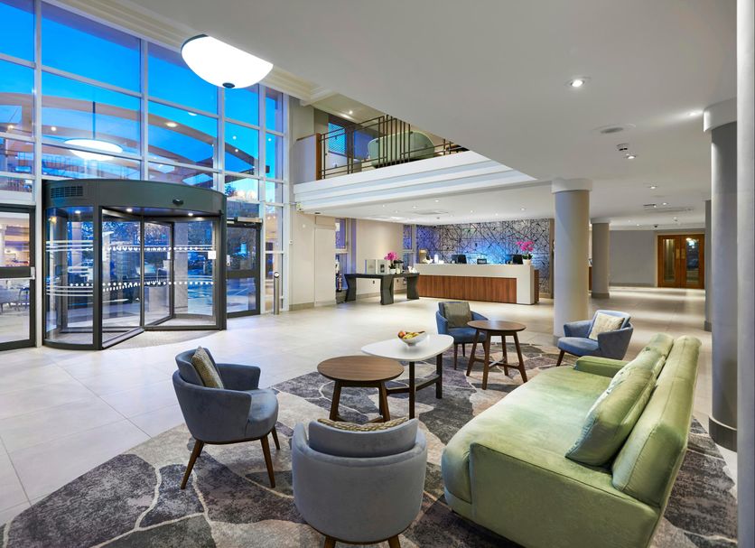 Hilton London Croydon lobby with seating area, glass entrance, and reception desk in Croydon