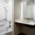 Canal Street New Orleans bathroom with tub shower combo, grab bars, and vanity sink