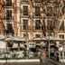 Hospes Puerta de Alcalá, Madrid: outdoor terrace with tables and umbrellas in front of a historic facade