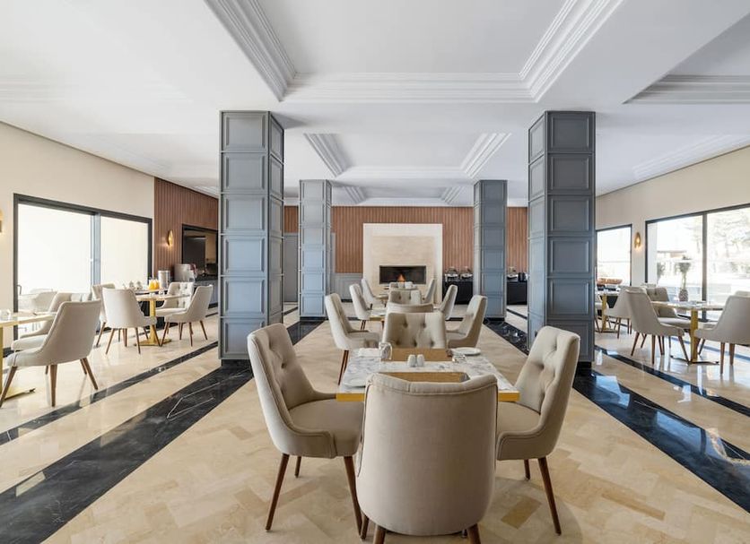 Kenzi Rissani in Errachidia dining room with set tables and large windows