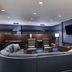 Courtyard by Marriott Scottsdale Old Town lounge with sectional sofa, chairs, wall-mounted TV and shelving