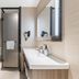 Hanting Nanshan Avenue Shenzhen bathroom with shower, sink, mirror and toilet