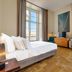 Pousada de Lisboa in Lisbon guest room with sea view, parquet floors, and seating area