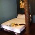 Baia Baia Resort in Ko Phi Phi, bed with towels in a small rustic guest room