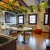 Margherita House Venice kitchen and dining area with hanging greenery and wood beams in Venice