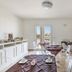 Breakfast room at Imperial Exclusive Rooms And Breakfast in Porto Cesareo with set tables and white cabinets