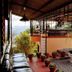 Stupa Resort in Nagarkot terrace with potted plants, lounge seating and mountain view