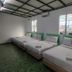 Casa Hotel Near Klia 1 in Sepang twin room with three single beds and green carpet flooring