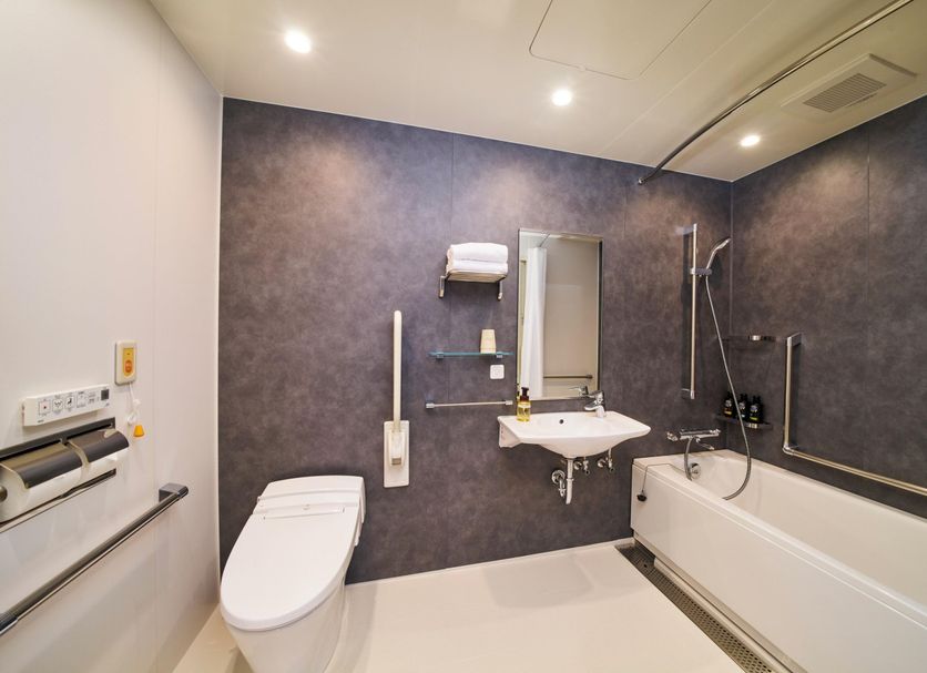 Koko Hotel Osaka Namba Sennichimae bathroom with toilet, sink, bathtub and shower in Osaka