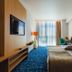 Marina Burgas Hotel room in Burgas with king bed, desk, TV, and floor-to-ceiling window
