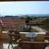 Elafonisos Diamond Resort in Elafonisos, balcony with wicker chairs and sea view
