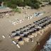 Kaiafas Lake Hotel in Zacháro with beach umbrellas and loungers beside the shoreline