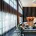 AC Hotels by Marriott Tallahassee Universities at the Capitol lobby with lounge seating, staircase, and tall windows