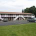 Nader's Motel & Suites in Ludington with outdoor parking and exterior stair access to second-floor rooms