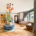 Cairn Hotel Newcastle Jesmond lobby with herringbone wood floor, curved seating, and copper pendant lights in Newcastle upon Tyne