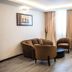 Alisa Hotel North Ridge in Accra with a cozy lounge seating area and modern reception desk