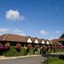 Premier Inn Northampton West - Harpole in Northampton with ivy-covered walls and hanging flower baskets