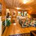 Highland Hills Motel & Cabins in Boone: cozy log-cabin bedroom with two beds and wood-paneled walls
