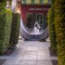 Crowne Plaza Marlow by IHG entrance garden path with circular fountain sculpture in Marlow