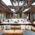 Jiva Hill Resort - Genève lounge with plush seating, wooden beams, and large windows in Crozet