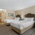 Best Western Timberridge Inn Grove guest room with two beds and armchair