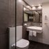 Hotel Württemberger Hof Reutlingen bathroom with glass shower, sink, toilet and mirror