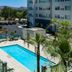 Element Ontario Rancho Cucamonga in Ontario with outdoor pool, palm trees and parking lot view