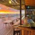River Crossing Lodge Windhoek rooftop bar with sunset views over the deck and surrounding hills