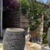 Chambres d'Hôtes Terra Bella in Sainte-Lucie-de-Porto-Vecchio with stone garden planters and greenery
