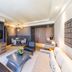 Radisson Collection Hotel Bamako guest room with TV, seating area, and modern furnishings