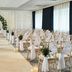 Portsmouth Marriott Hotel in Portsmouth wedding ceremony setup with floral arch and rows of white chairs