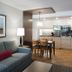 West Coast Suites At Ubc in Vancouver: suite with sofa, dining table and kitchenette