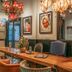 Poshpacker - Chengdu Flipflop Hostel lobby with long wooden table, chairs, potted plant, and chandeliers in Chengdu