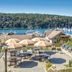 Worldmark Deer Harbor patio with umbrellas, tables and marina views in Deer Harbor