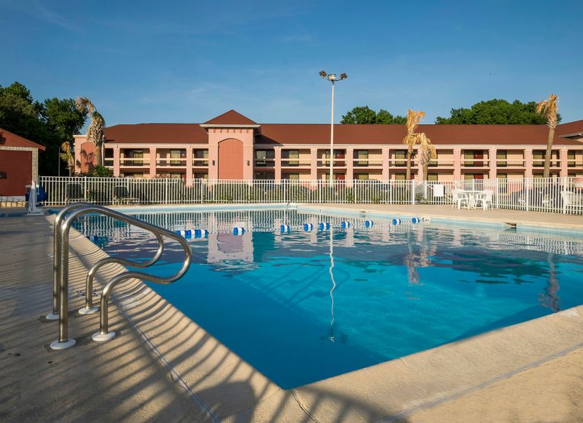 Red Roof Inn Virginia Beach - Norfolk Airport outdoor pool with deck and hotel building in Virginia Beach
