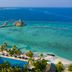 Emerald Faarufushi Resort & Spa in Ifuru with a beachfront pool, palm trees and turquoise ocean view