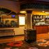 Fiesta Rancho Hotel And Casino in Las Vegas lobby bar with warm lighting and floral carpet
