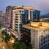 Evening city street view beside Zhangzhou Yinjia Hotel (Gucheng Branch), Zhangzhou, with lit high-rises