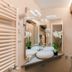 Relais Tosinghi Florence bathroom with vanity, mirrors, orchids and glass shower enclosure