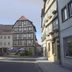 Bayerischer Hof in Münnerstadt with half-timbered buildings and street-side view