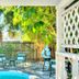 Seahorse Cottages on Sanibel - Adults Only: courtyard pool with lounge chairs and tropical greenery