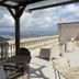 Enna Inn Centro terrace with seating and panoramic hilltop mountain views in Enna