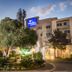 Garden Court Eastgate in Johannesburg exterior with landscaped entrance and lit facade at dusk