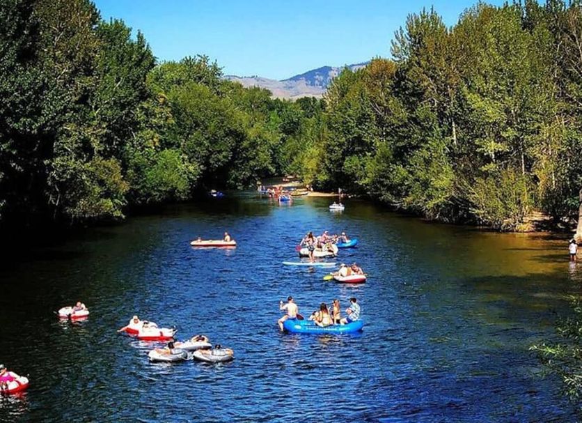 Layover Inn Boise Airport in Boise near river with people kayaking on a scenic tree-lined waterway