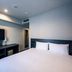 Plaza Hotel Tenjin in Fukuoka guest room with bed, TV, and compact desk area