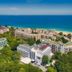 Prestige Deluxe Hotel Aquapark Club in Golden Sands with sea views over beachfront resort buildings.